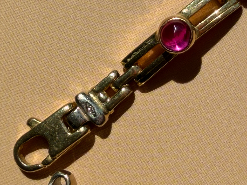 18k gold open bar link bracelet with ruby cabochon