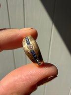 gorgeous square cut sapphires and diamond in tapered gold band