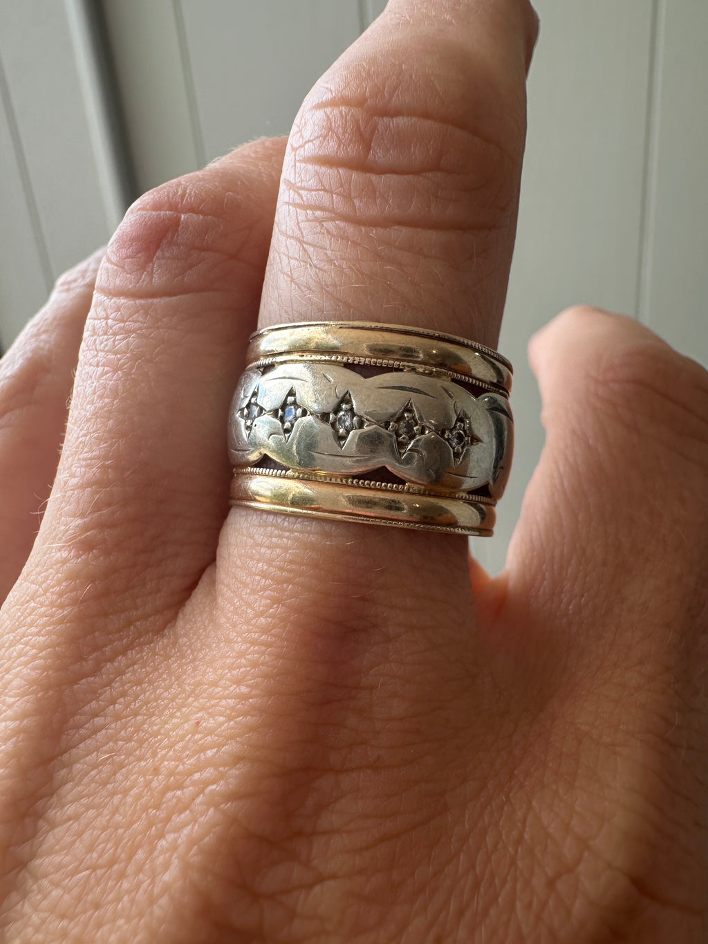 wide two tone band with star set diamonds