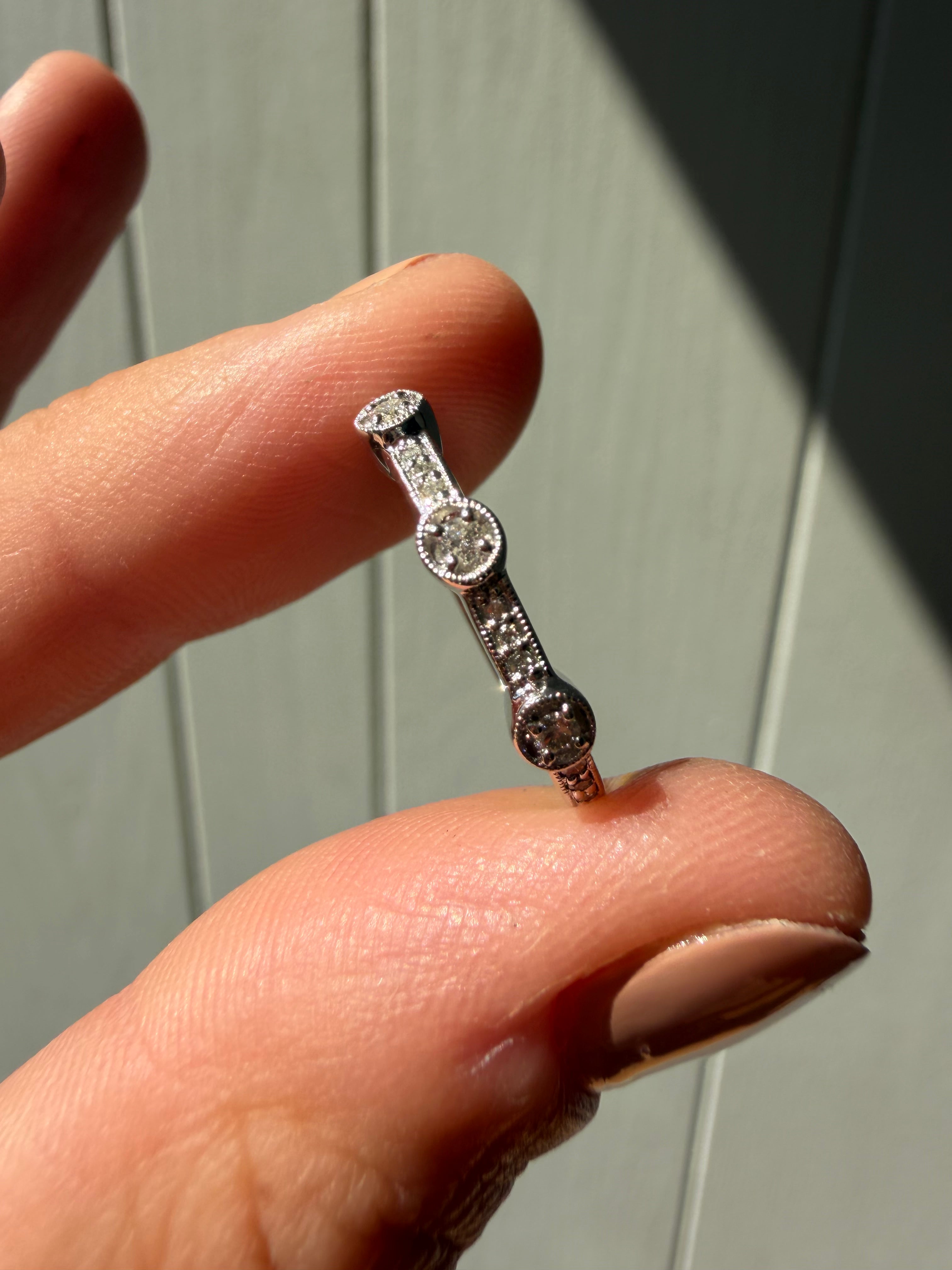 white gold and bezel set milgrain diamonds
