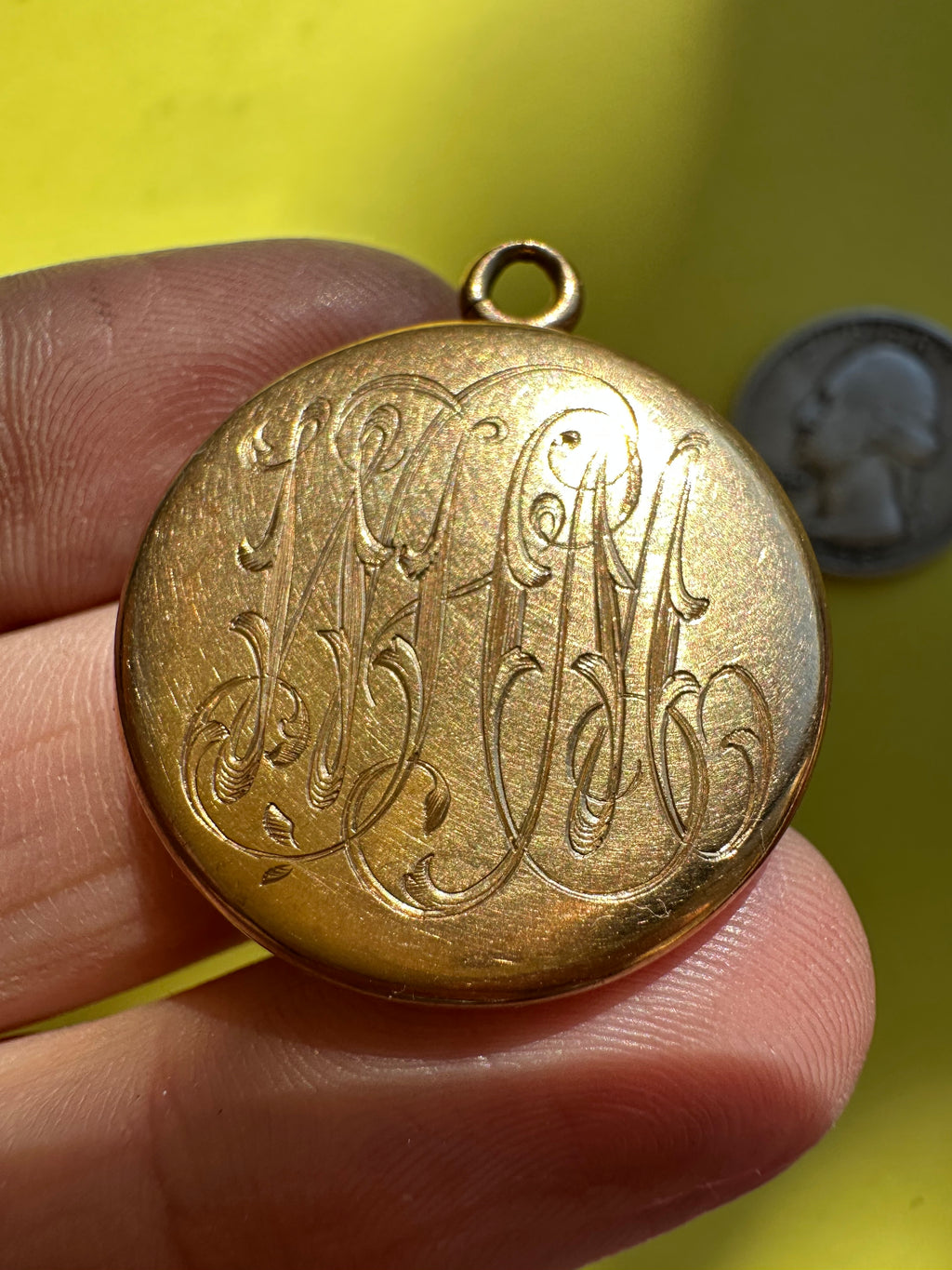 antique round engraved locket