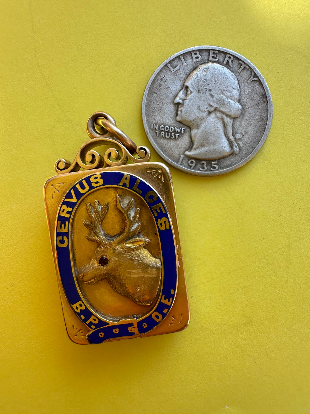 antique two sided locket with elk and monogram