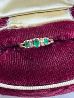 oval cut emerald and round cut diamond ring