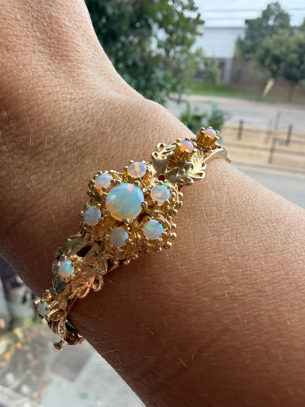 striking engraved opal burst hinge bangle