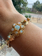 striking engraved opal burst hinge bangle