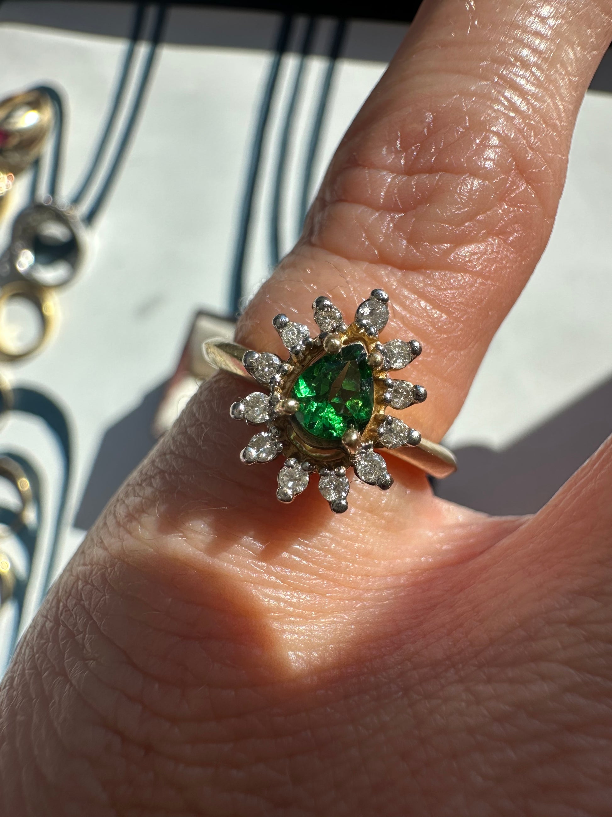 tsavorite garnet and diamond halo ring