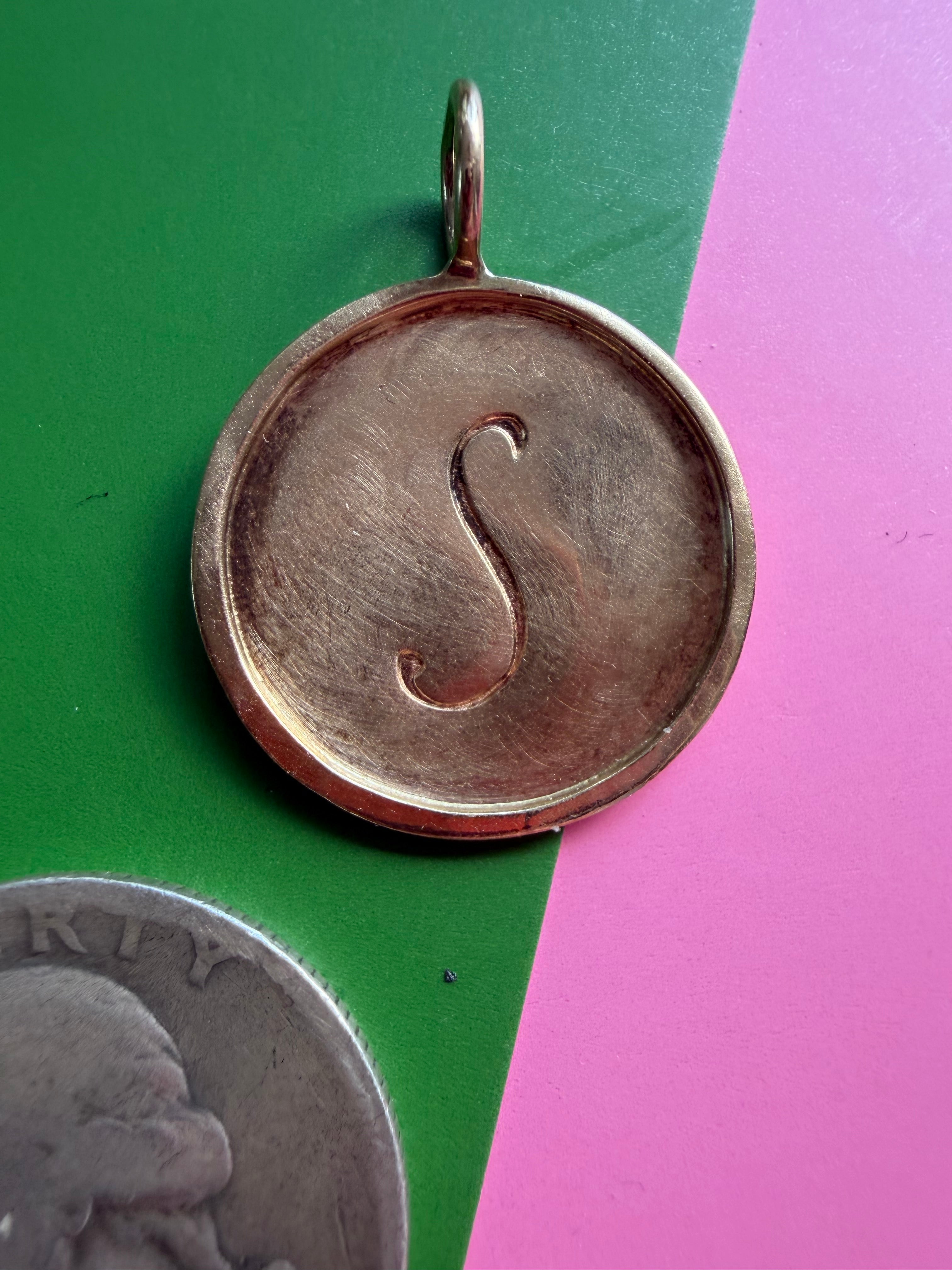 S medallion