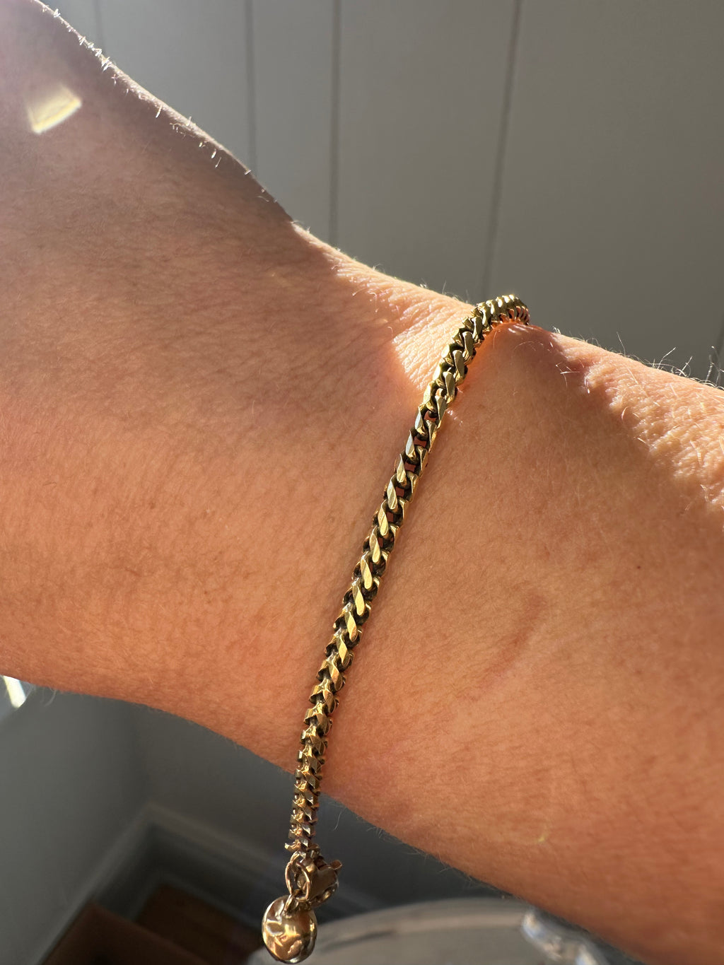 18k gold rounded wheat bracelet with jingle bell