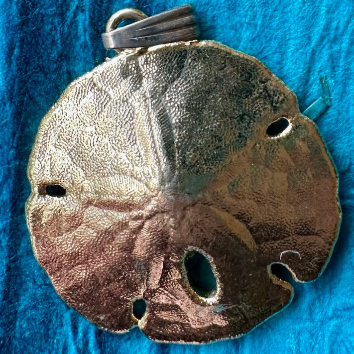 Vintage gold plated sand dollar pendant