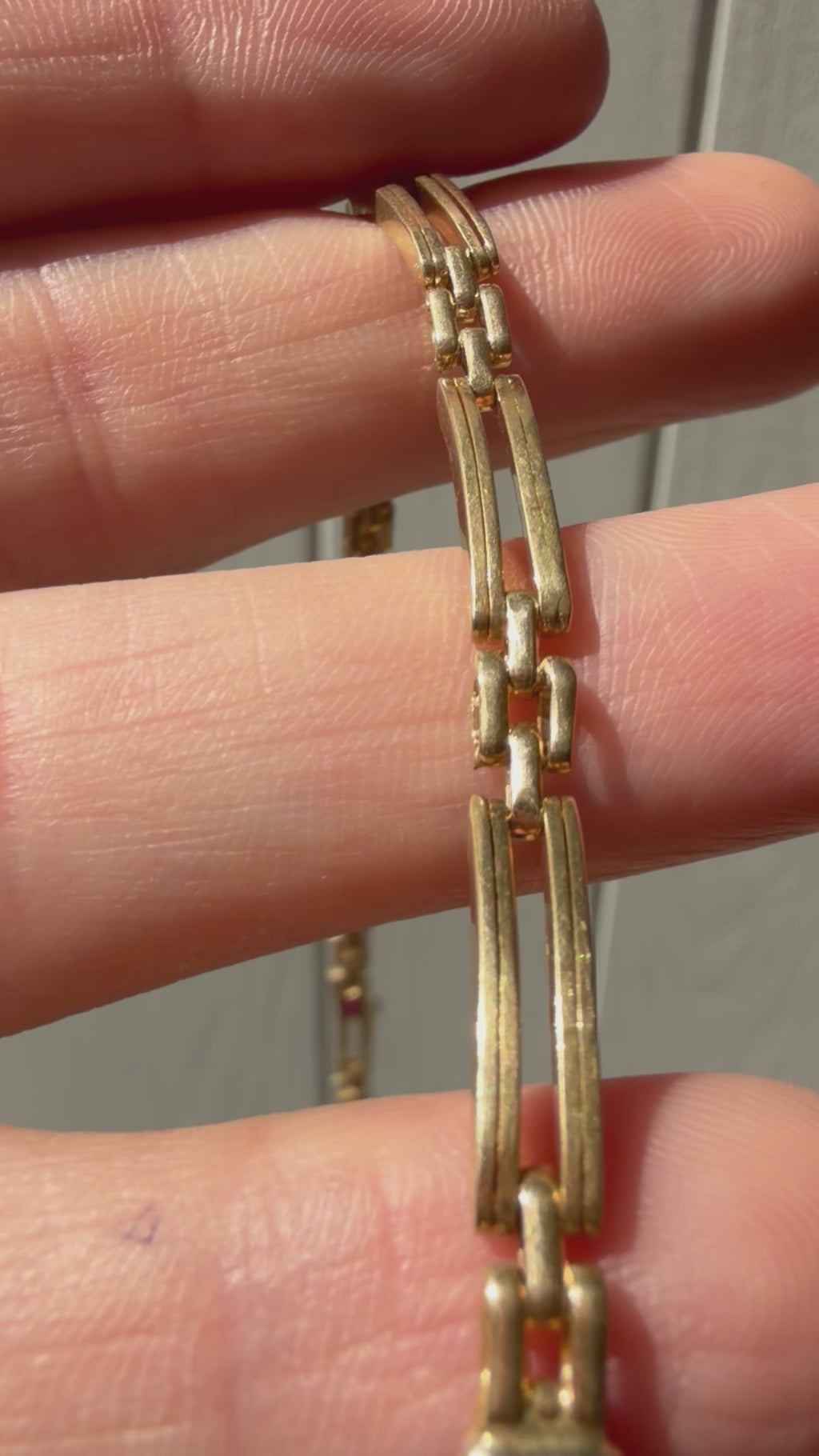 18k gold open bar link bracelet with ruby cabochon
