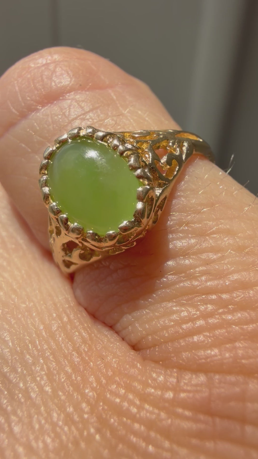 open work bezel set oval jade