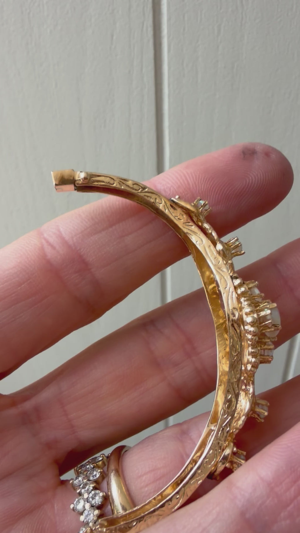 striking engraved opal burst hinge bangle