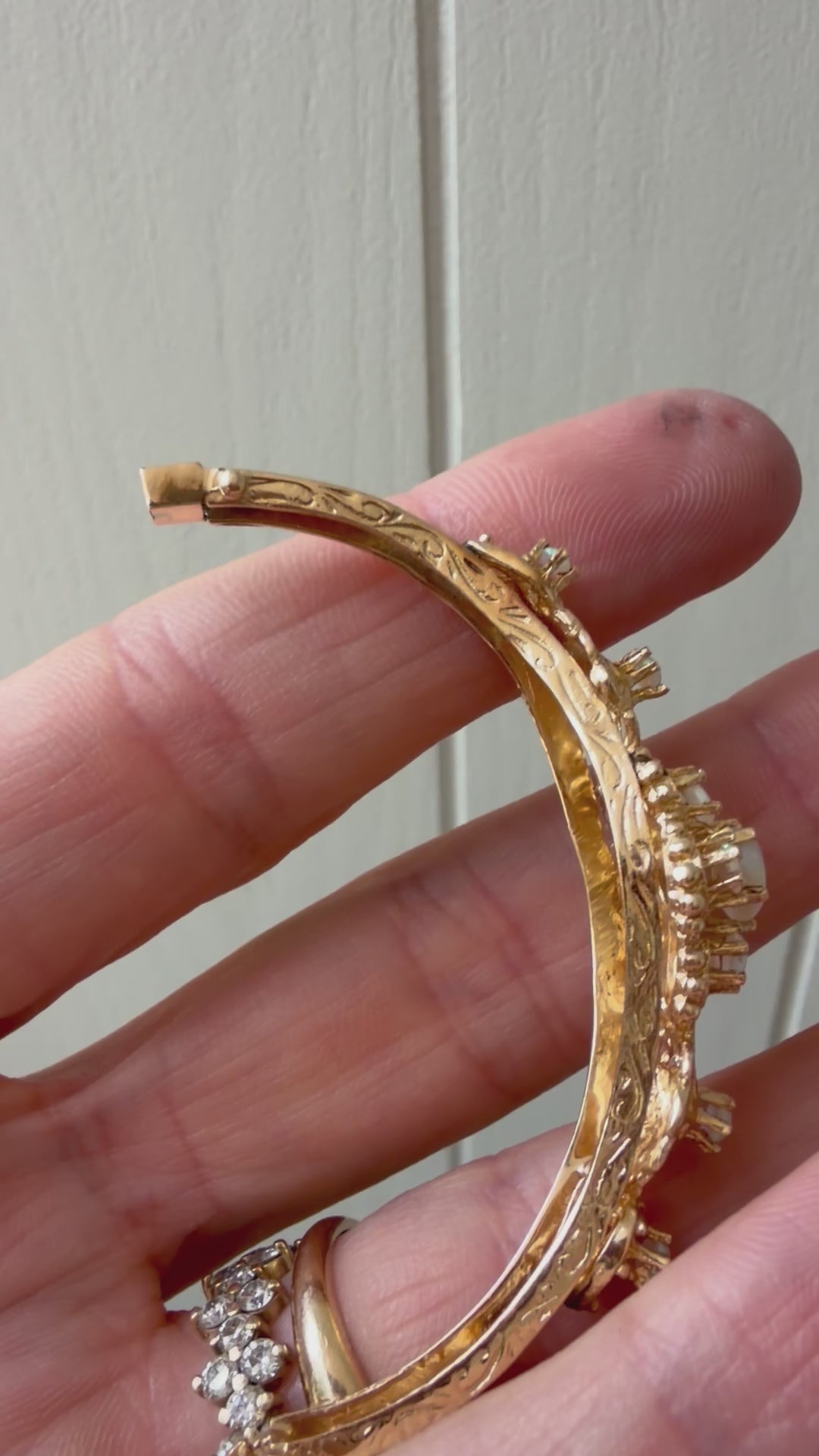 striking engraved opal burst hinge bangle