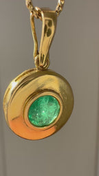 emerald in 18k bezel