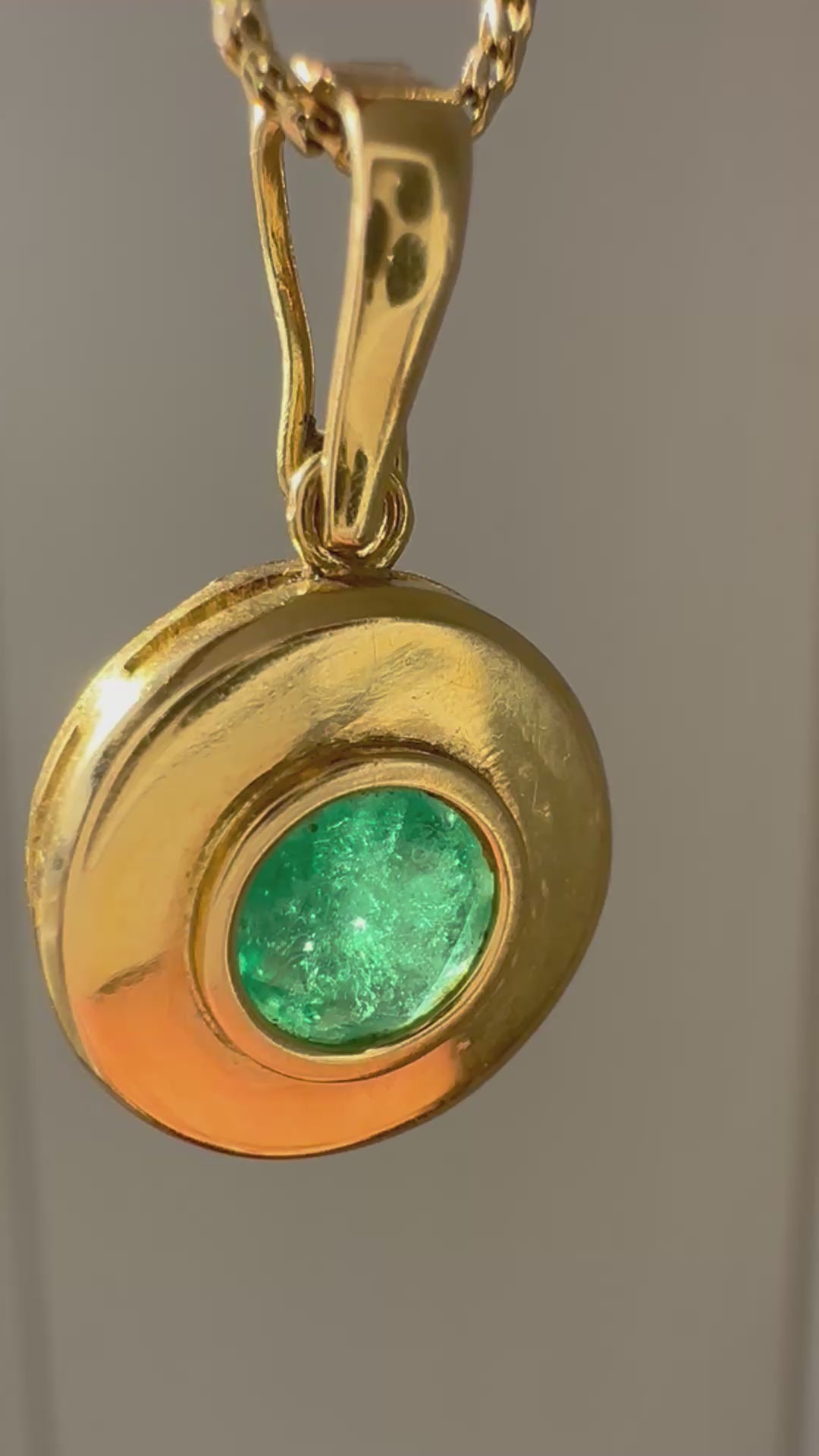 emerald in 18k bezel