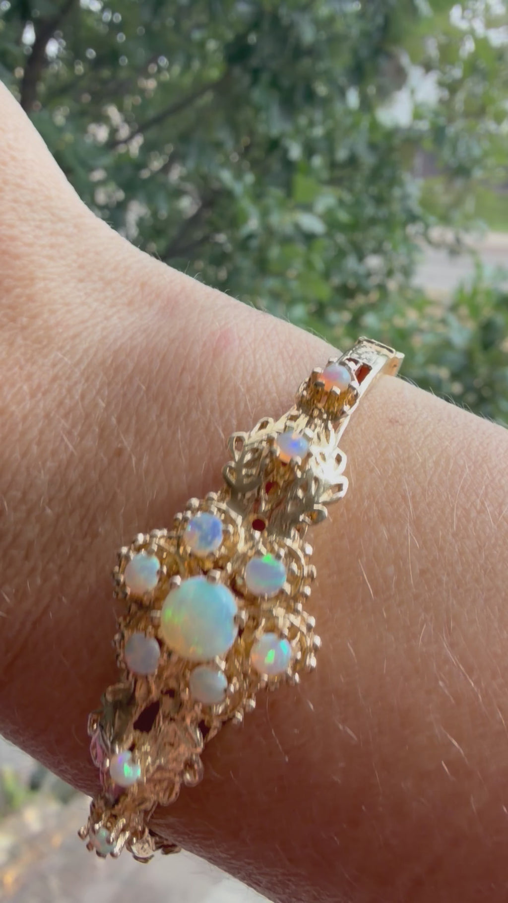 striking engraved opal burst hinge bangle