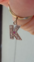 yellow gold donut with white gold diamond and ruby K charm
