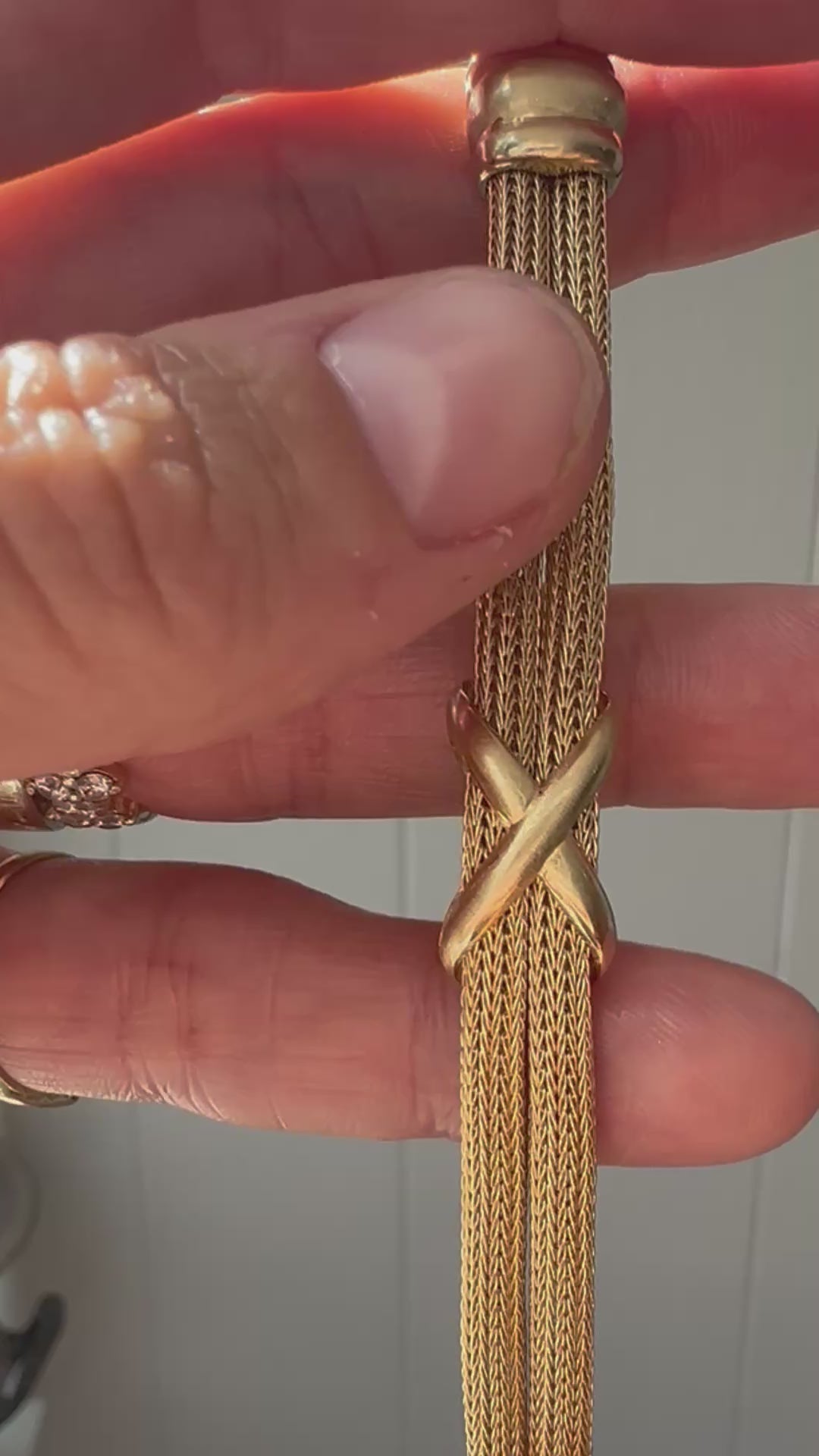 mesh bracelet with x and bar stations