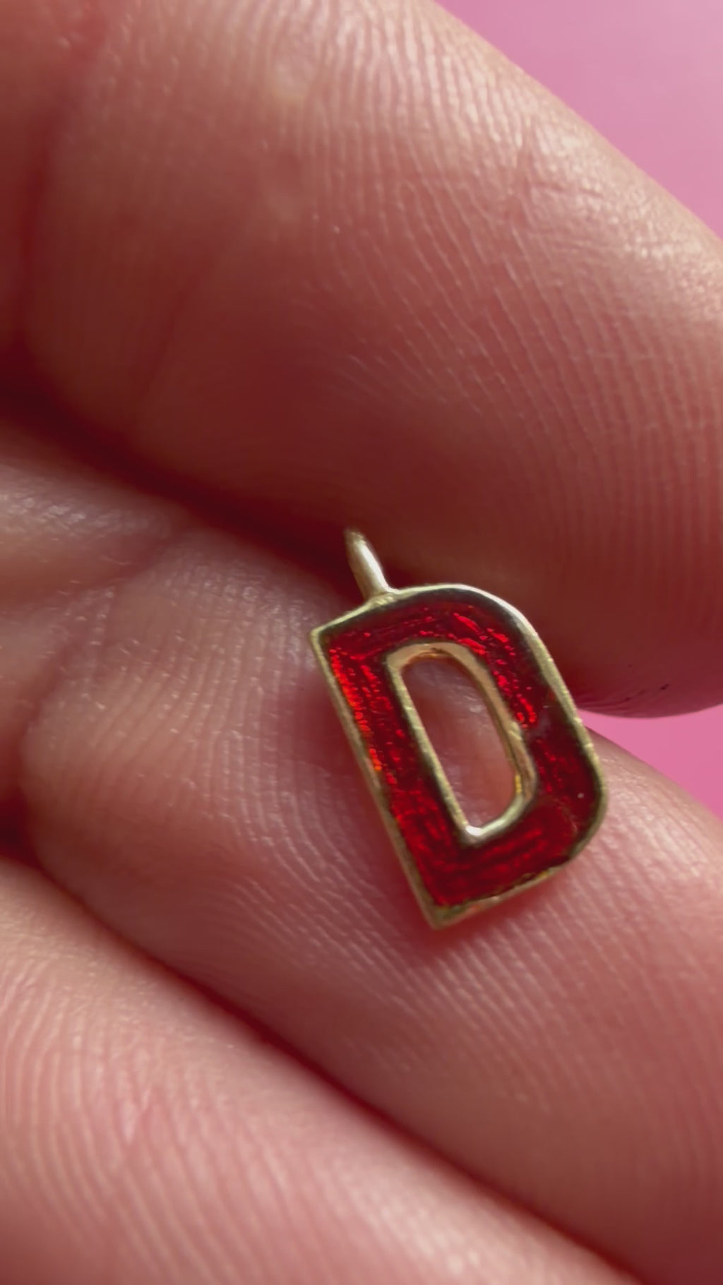 red enamel letter D