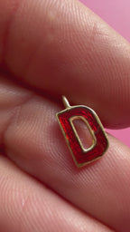 red enamel letter D