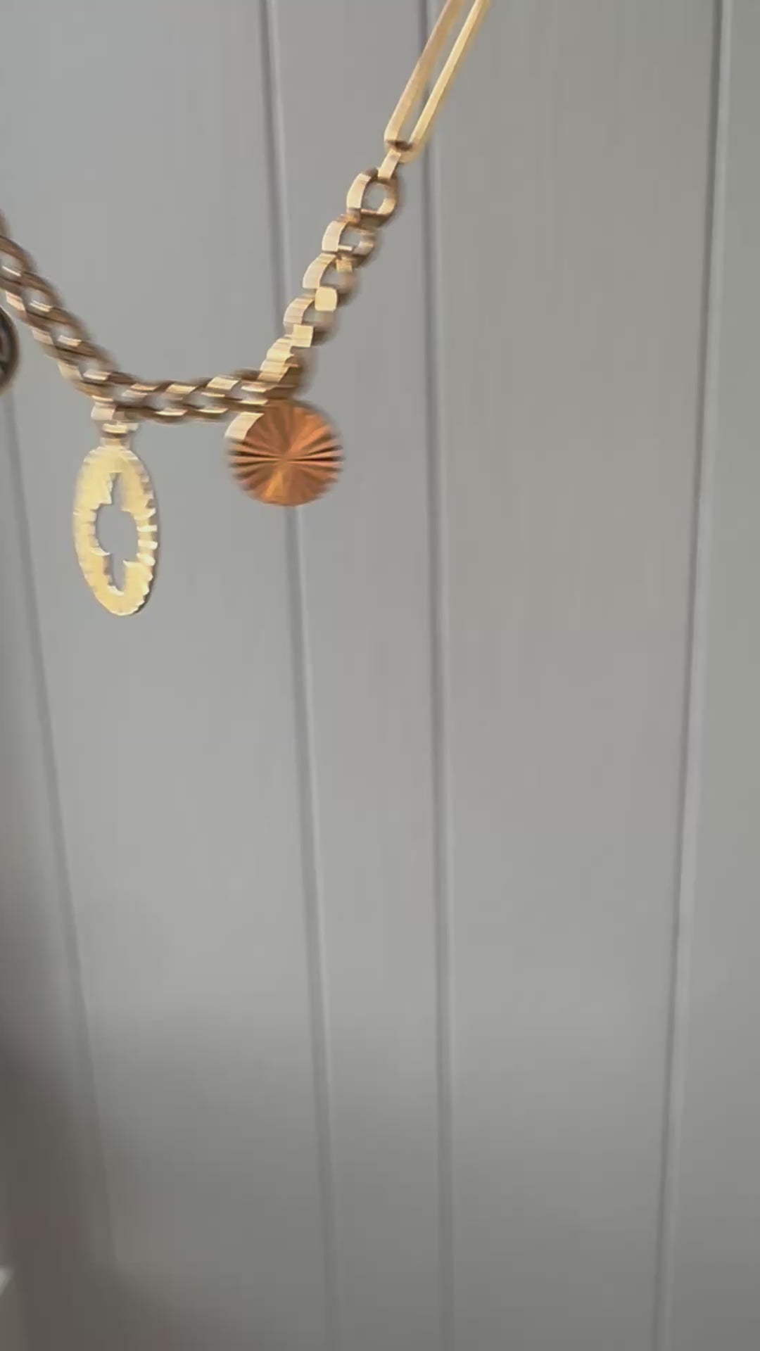 21k gold paperlink and curb charm bracelet