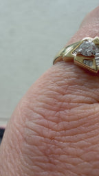 triangle ring with baguettes and round diamond