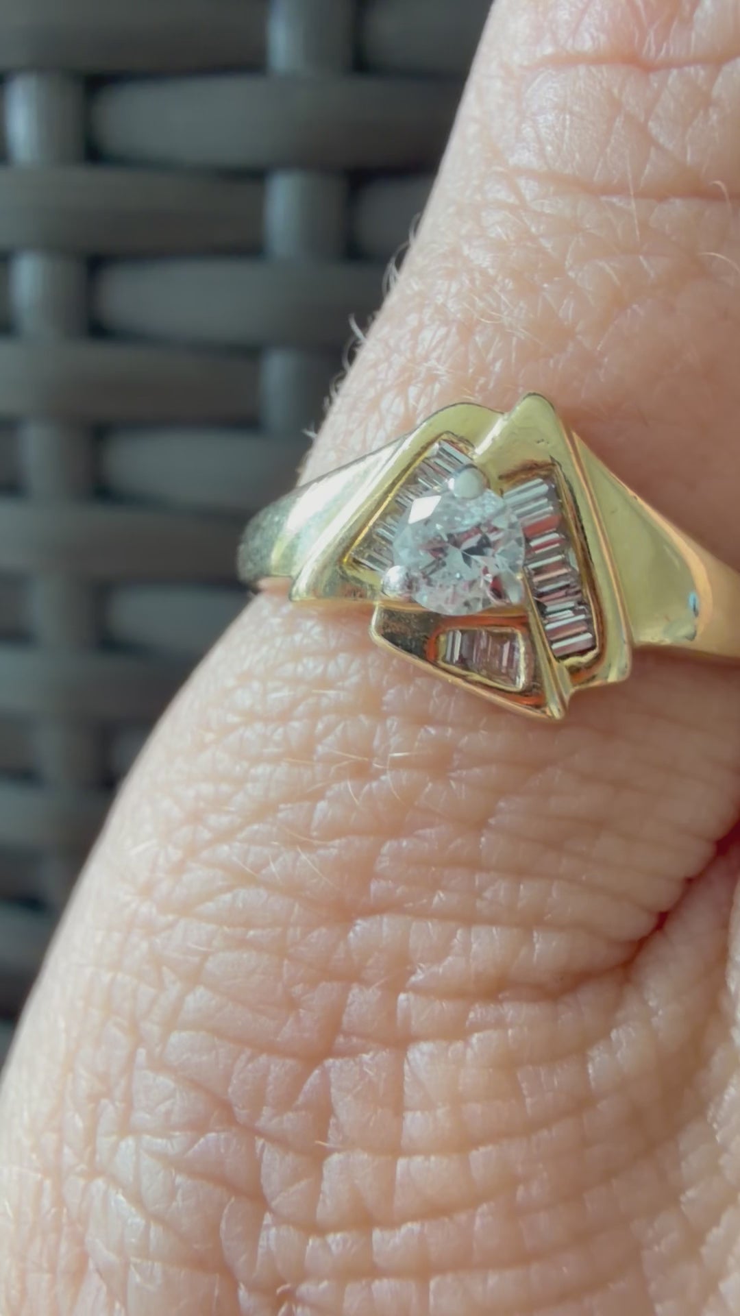 triangle ring with baguettes and round diamond