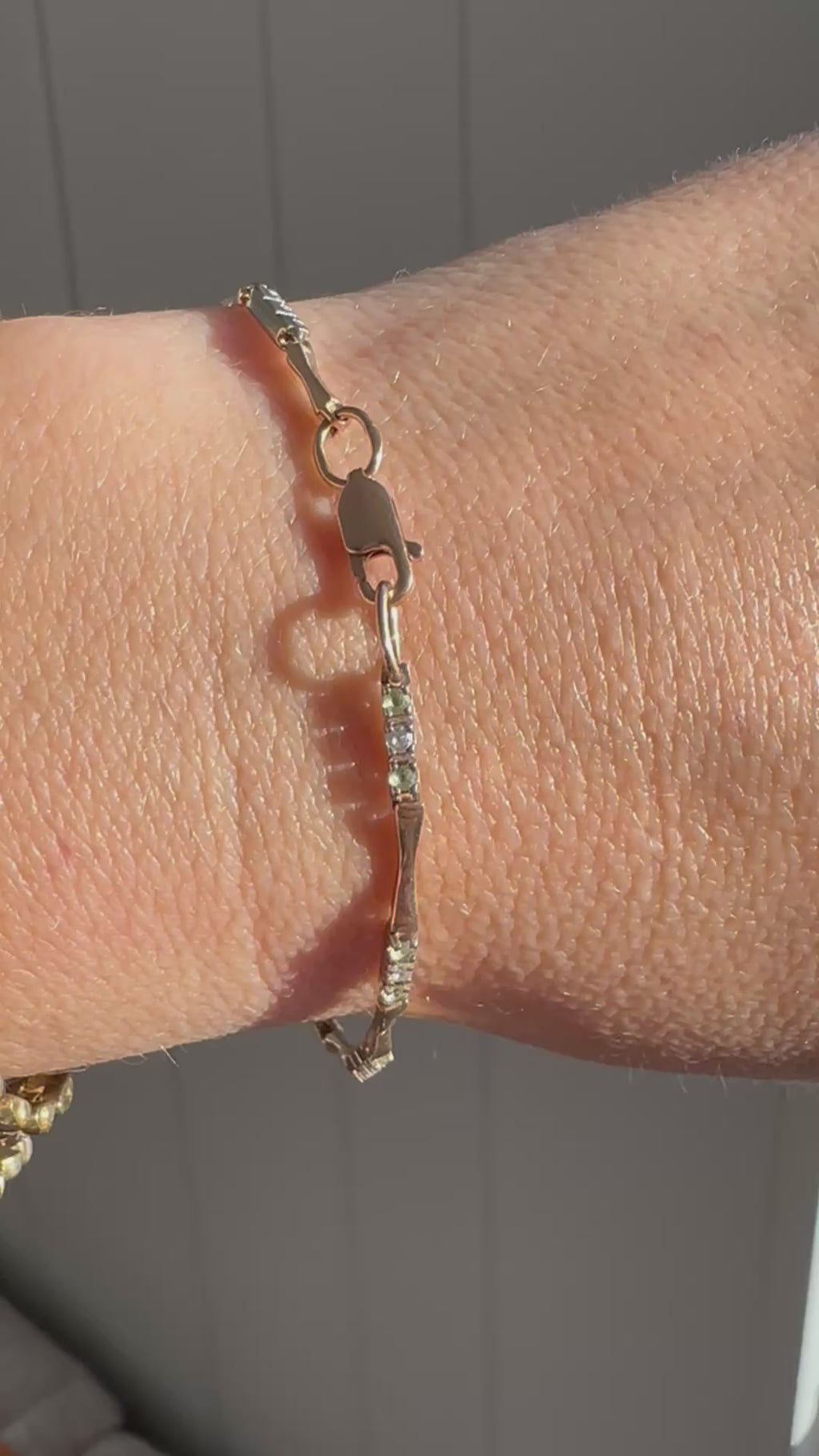 station bracelet with green and white gems