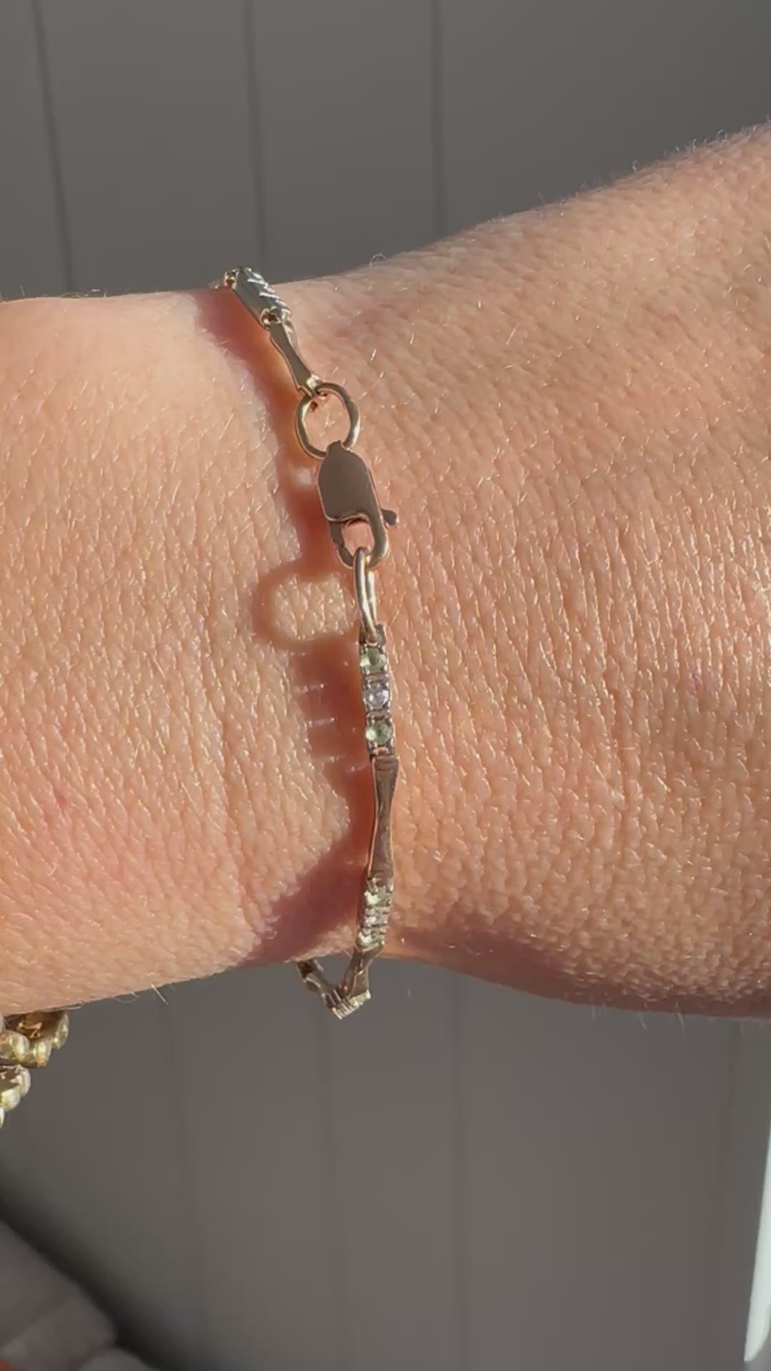 station bracelet with green and white gems