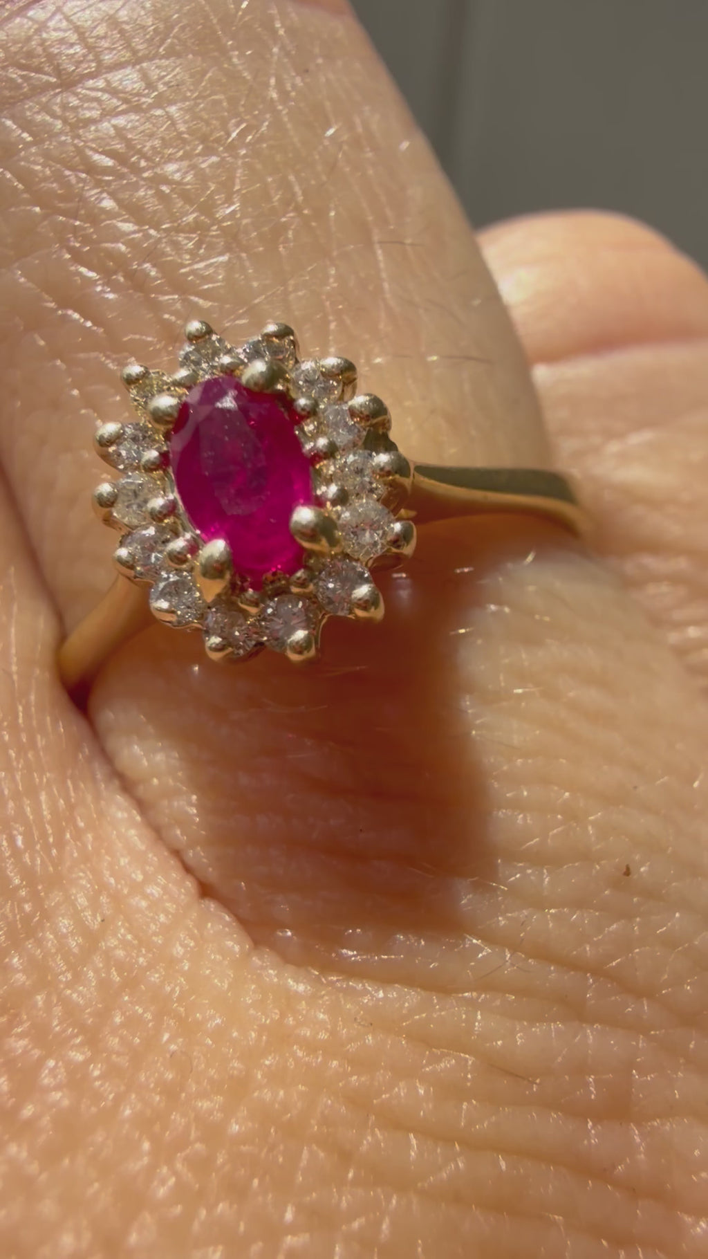 oval cut ruby with natural diamond halo