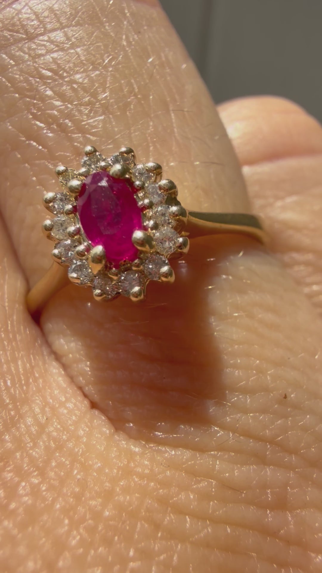 oval cut ruby with natural diamond halo