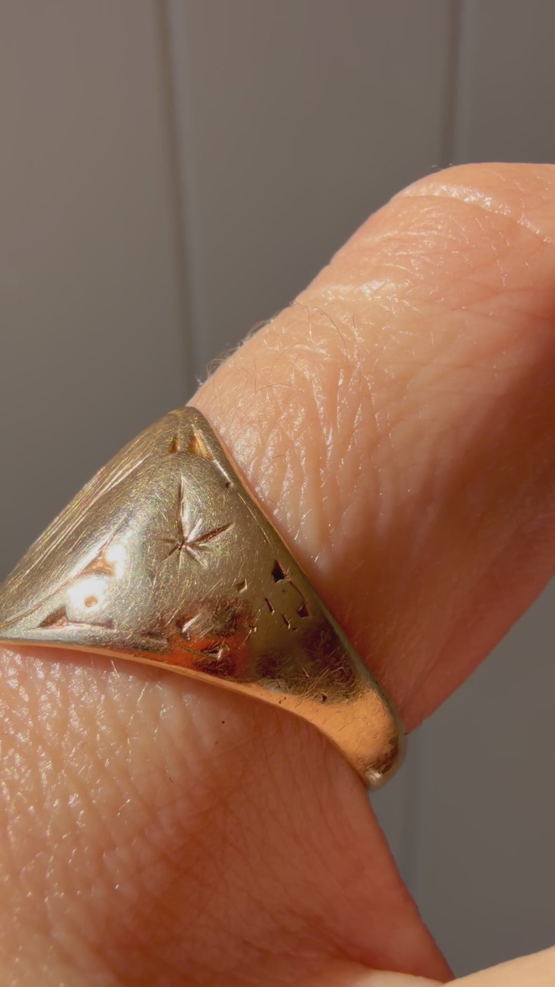 hand engraved worn signet with starbursts