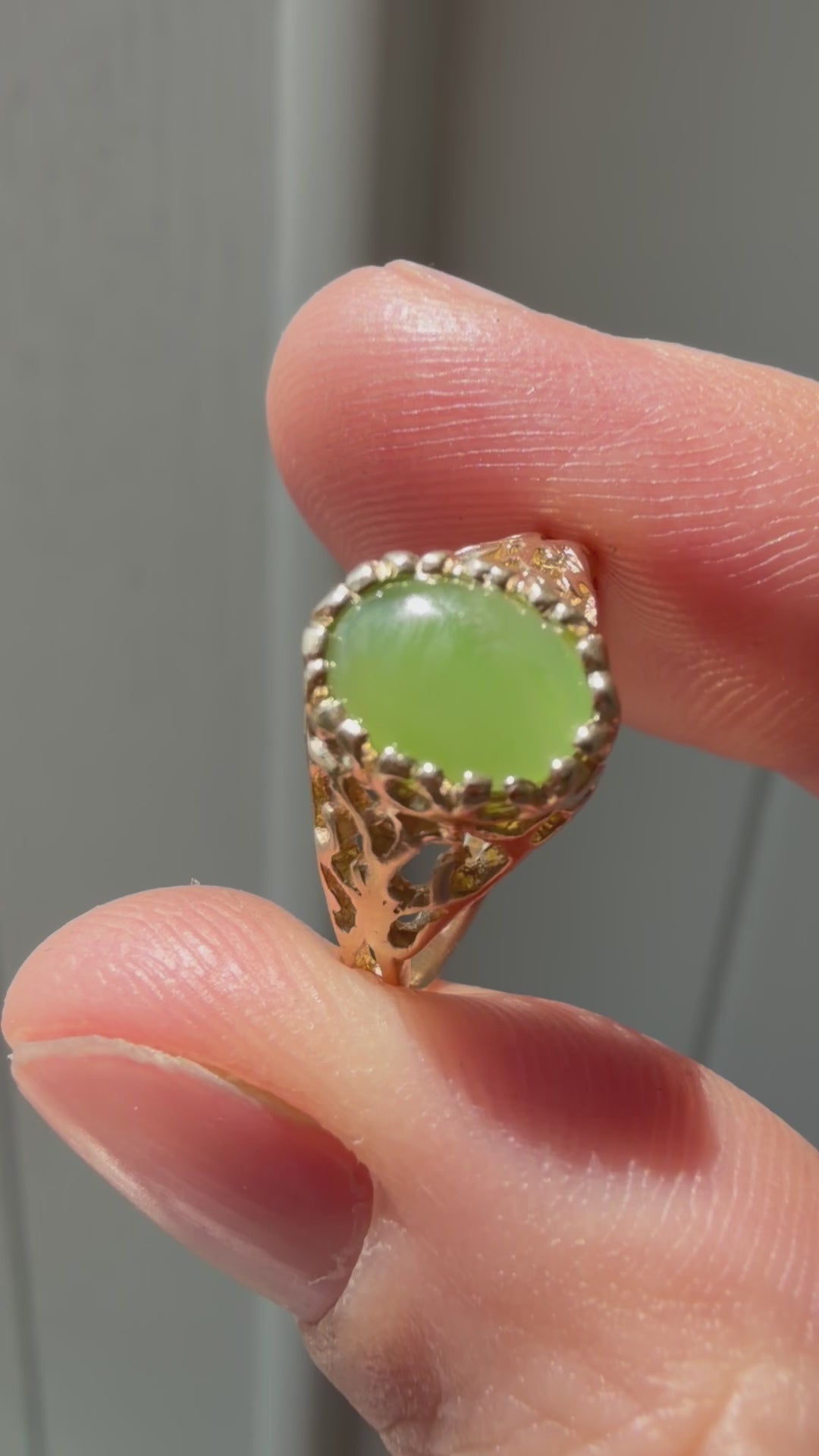 open work bezel set oval jade