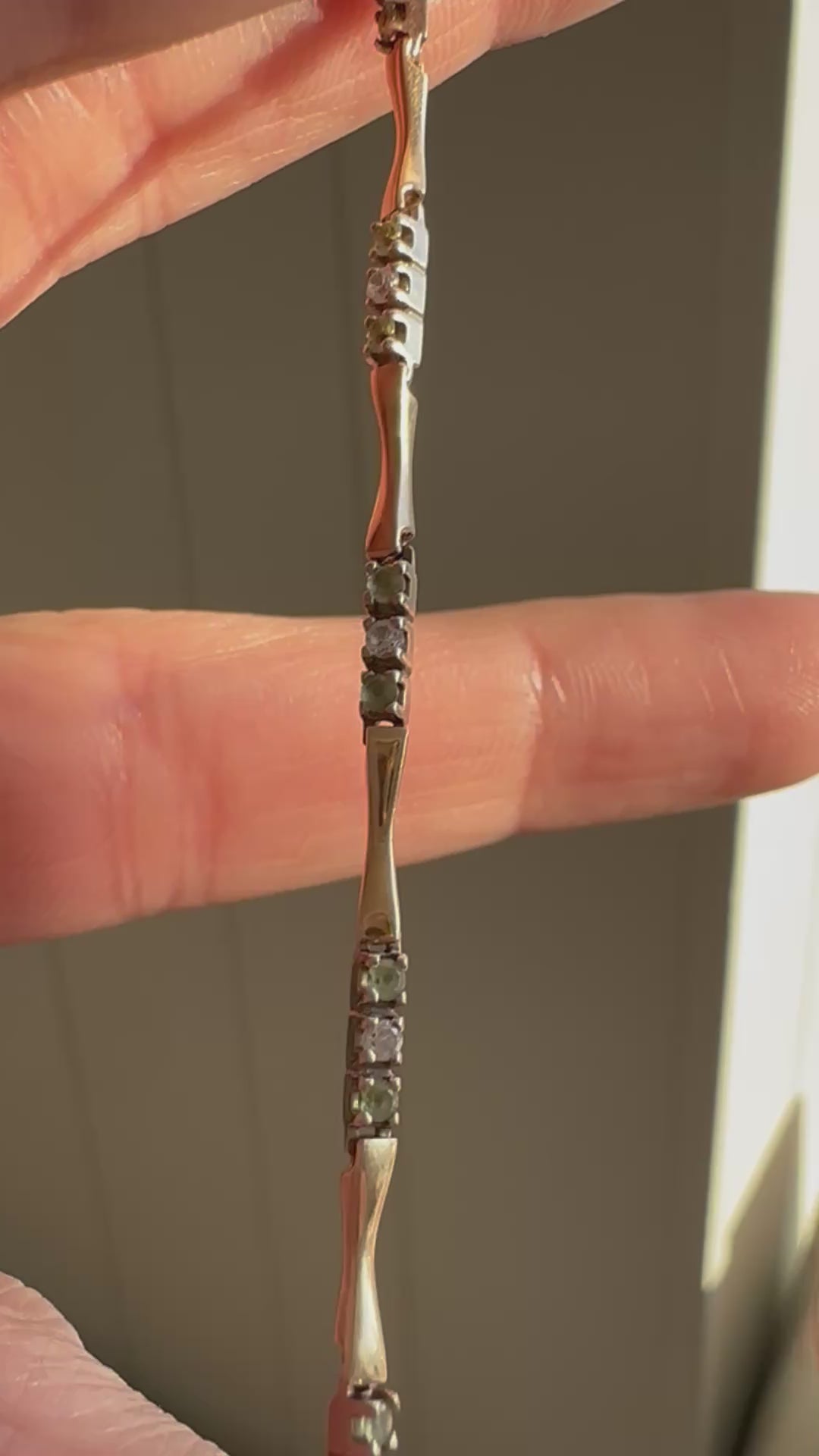 station bracelet with green and white gems