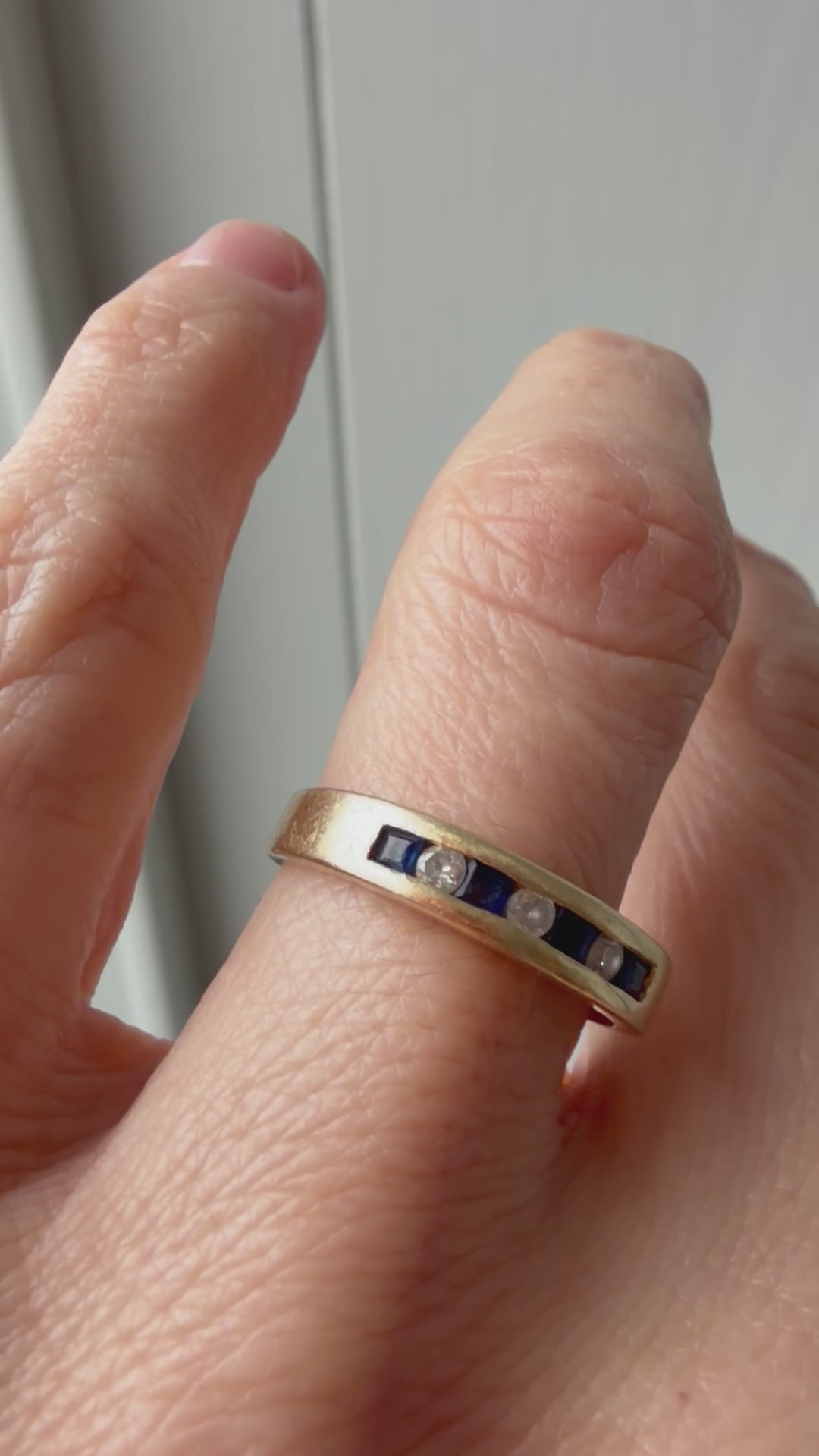 channel set sapphire and diamond band